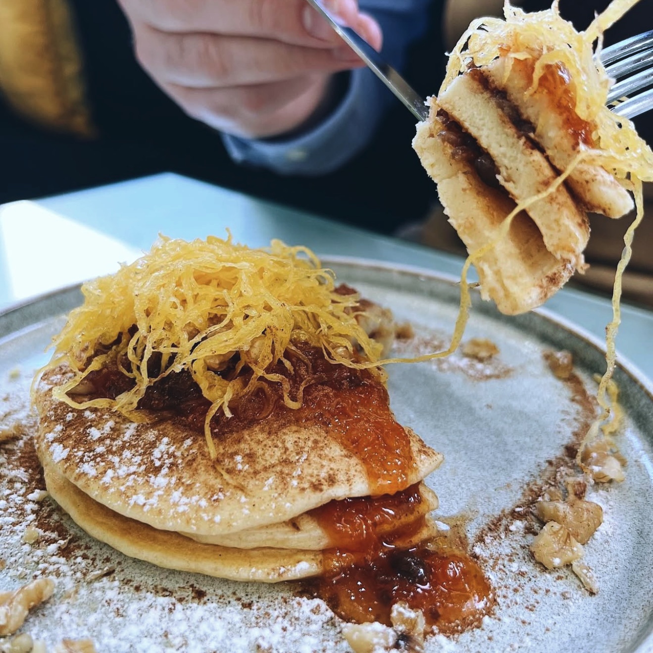 Three homemade pancakes, pumpkin jam, walnuts, egg threads, cinnamon, shot of red port wine